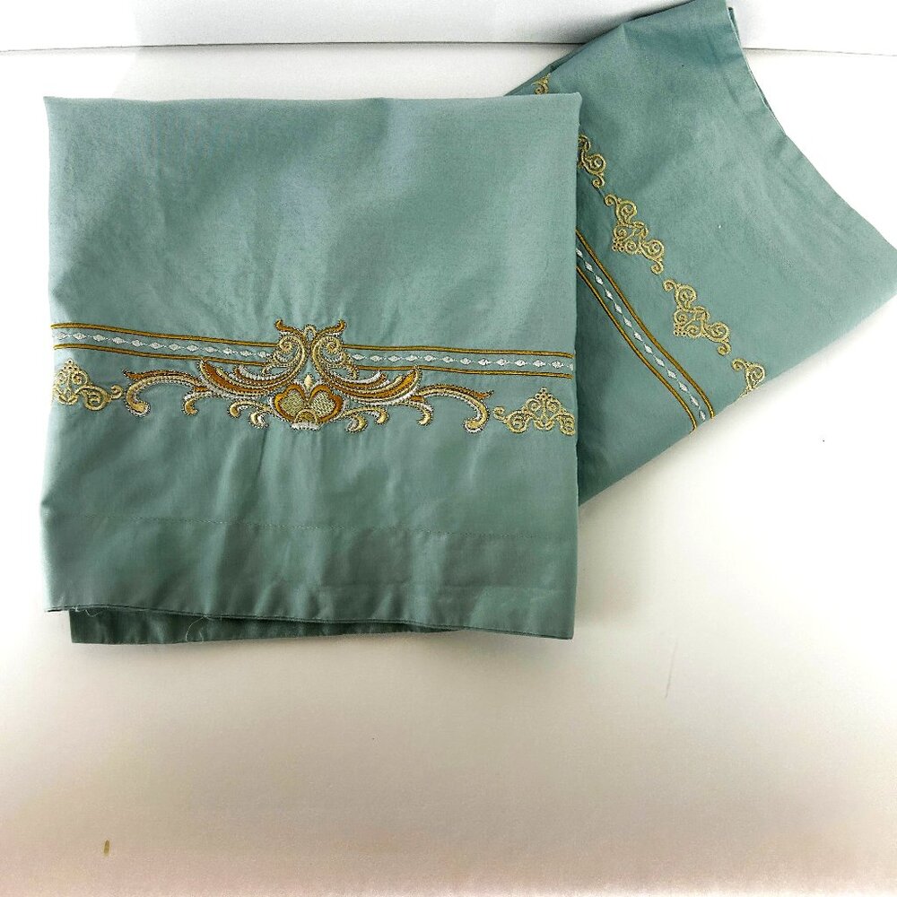 Pair of light blue pillow shams embroidered light gold and cream border 25x18